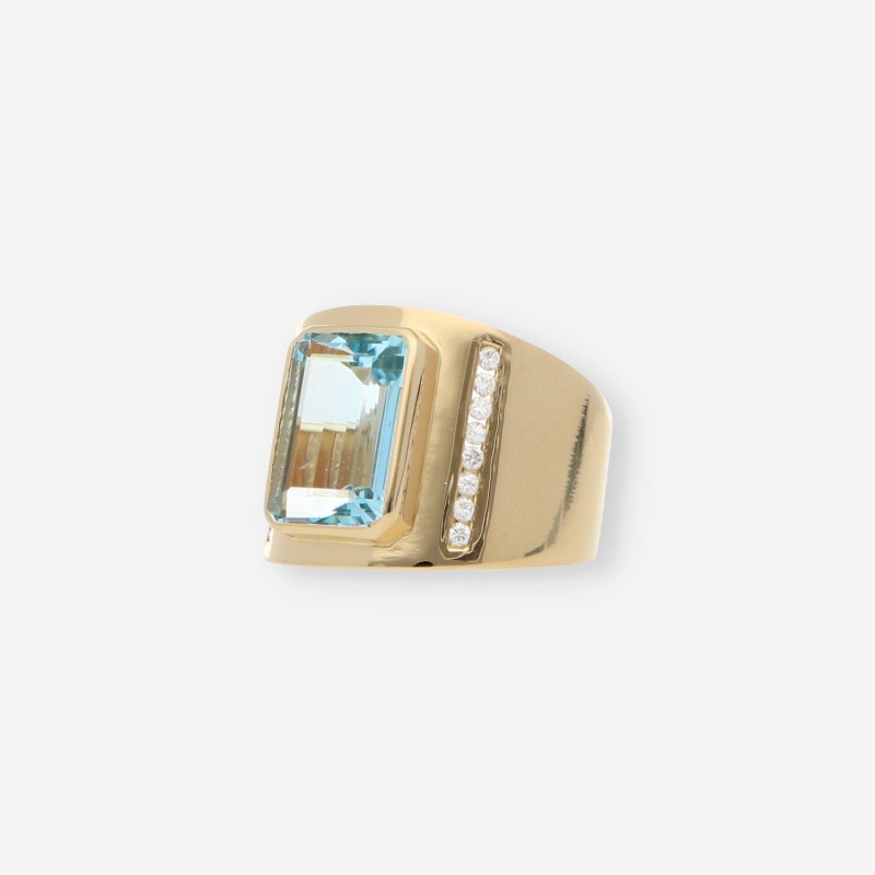 Anillo en oro 18kt con piedra azul y Brillantes