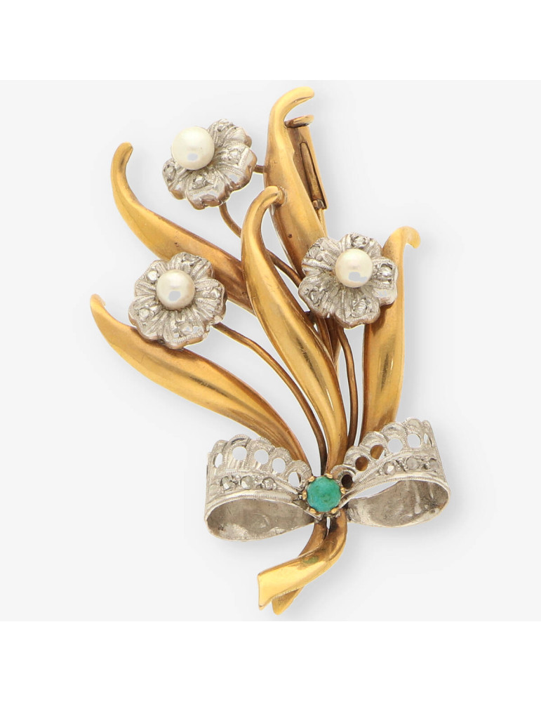 Aguja oro y diamantes