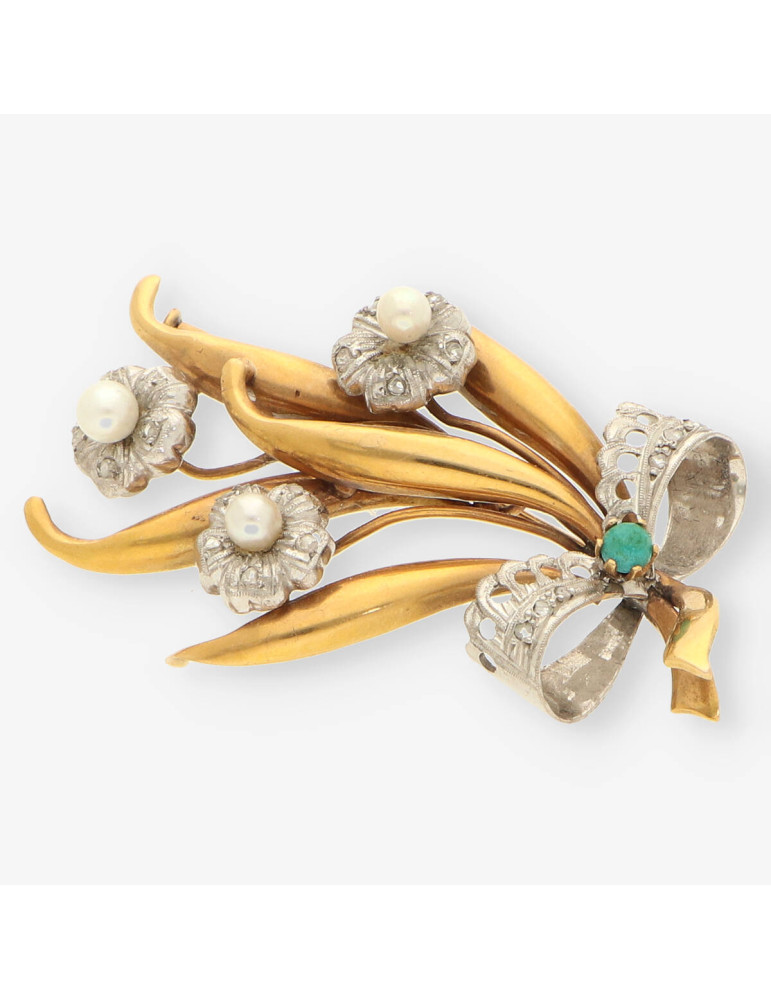 Aguja oro y diamantes