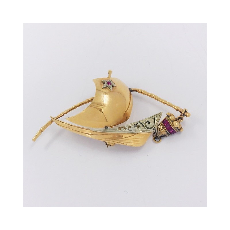 Broche en oro y piedras de color