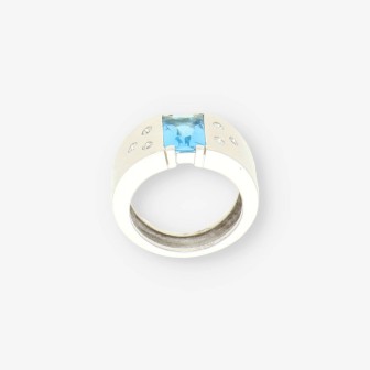 Anillo oro blanco piedra azul y bri