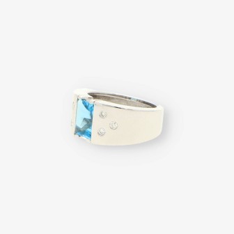 Anillo oro blanco piedra azul y bri