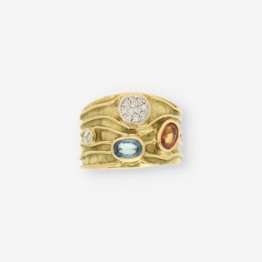 Anillo p. azul, p. naranja, oro y bri.